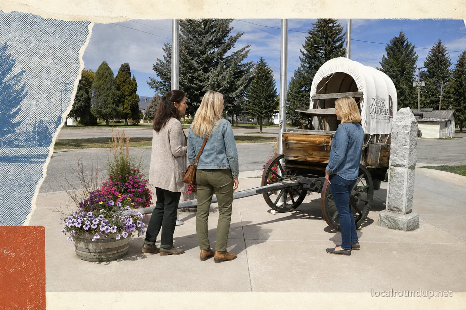 Three visitors viewing the covered wagon at the National Oregon California Trail Center